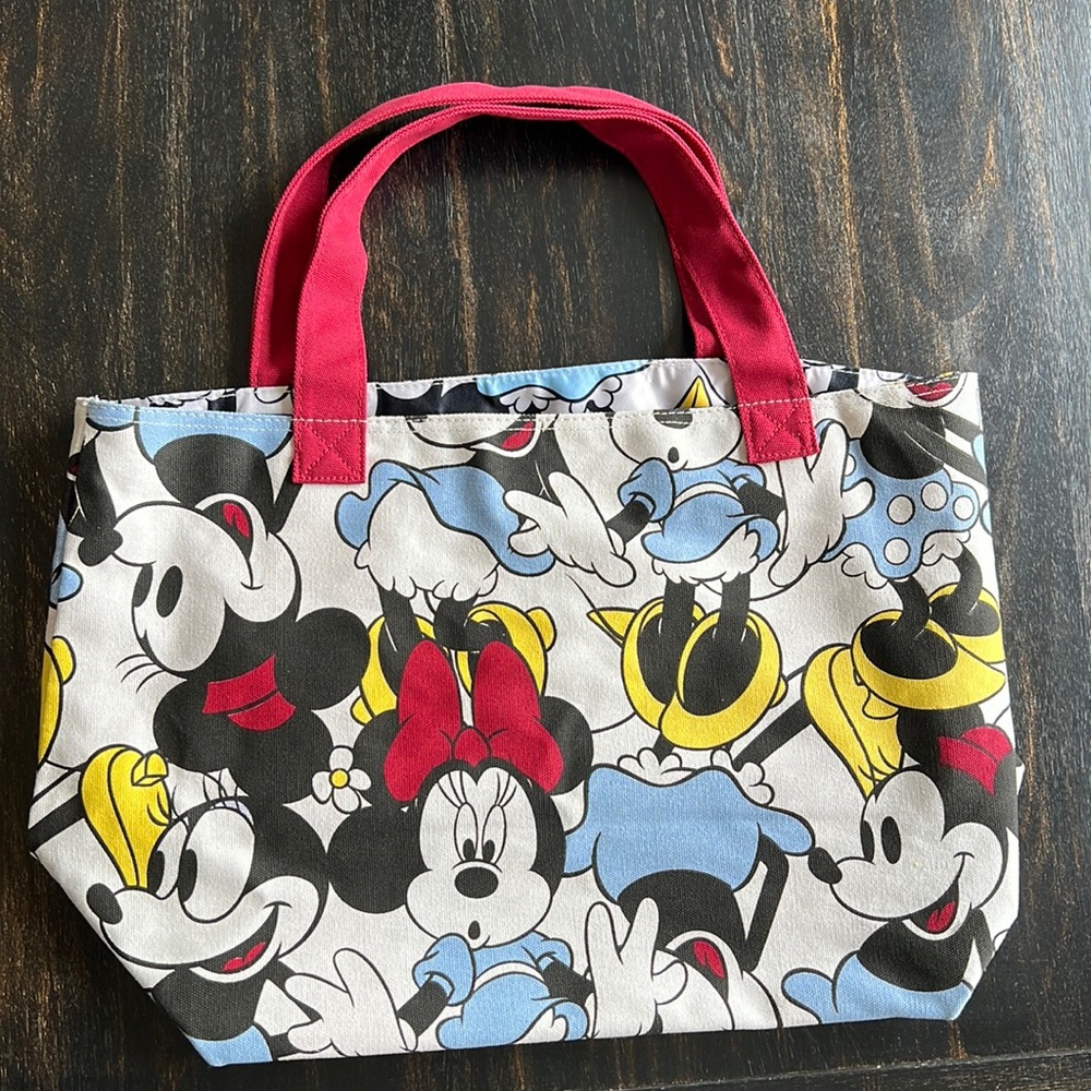 Disney Cream Canvas Tote Bag with one interior pocket. One size. New without Tag
